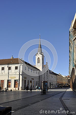 Church Ursulinelor with Ady Endre High School building from Republicii Avenue of Oradea City in Romania. Editorial Stock Photo