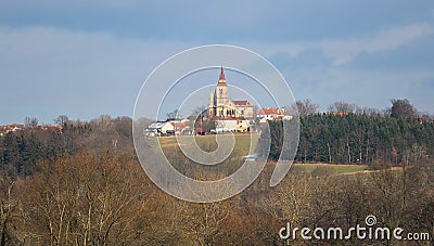 Church in village Hosin with dramatic sky, Czech landscape Stock Photo