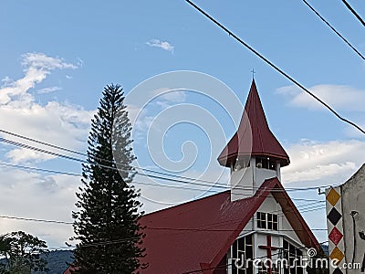 churches and trees with a beautiful and charming blue sky in the background Stock Photo
