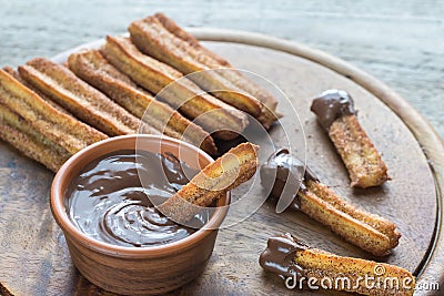 Churros - famous Spanish dessert with chocolate sauce Stock Photo