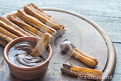 Churros - famous Spanish dessert with chocolate sauce Stock Photo