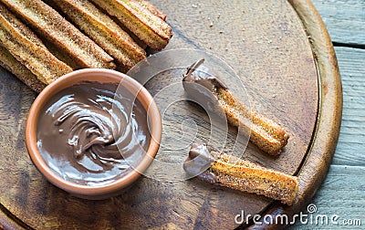 Churros - famous Spanish dessert with chocolate sauce Stock Photo