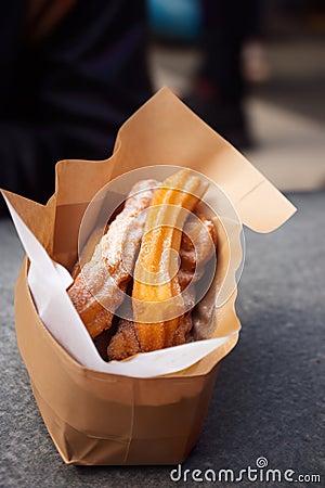 Churros in a paper bag, AI generative street food Stock Photo