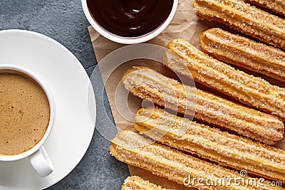 Churros Spain or Mexican breakfast meal street fast food dessert with cup of coffee Stock Photo