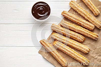 Churros traditional Spain street fast food baked sweet dough snack with chocolate Stock Photo