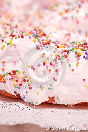 The ciaramicola is a typical Umbrian Easter cake; it is a donut-shaped cake, red in color with white icing and colored topping spr Stock Photo