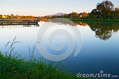 Ciekoty lake with view on Lysica mountain peak. Stock Photo