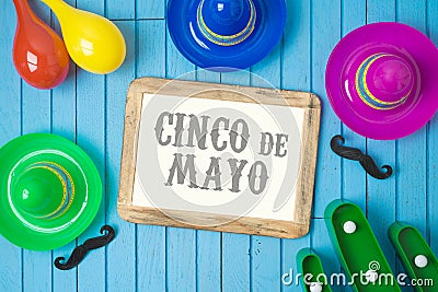 Cinco de Mayo holiday background with Mexican cactus, photo frame and party sombrero hat on wooden board Stock Photo