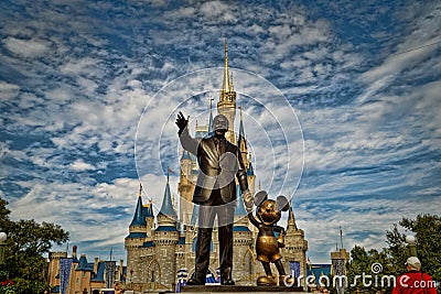 Cinderella`s castle in Magic kingdom with Walt Disney and Mickey statue Editorial Stock Photo