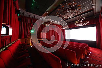 Cinema hall with chandeliers and seats. Stock Photo