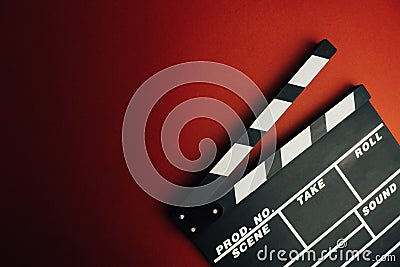 Cinema minimal concept. Watching film in the cinema. clapper board on red background. Stock Photo