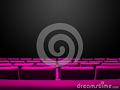 Cinema movie theatre with pink seats rows and a black background Stock Photo