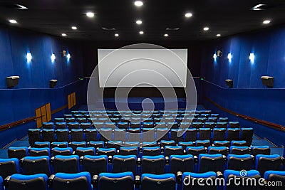 Cinema screen and seats in the hall Stock Photo