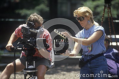Cinematographer with equipment filming Editorial Stock Photo