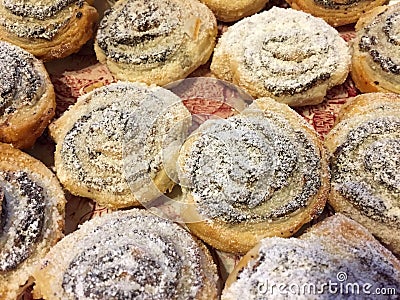 Cinnamon buns sprinkled with powdered sugar Stock Photo