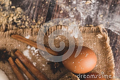 Cinnamon and eggs are placed on the sack and the flour Stock Photo
