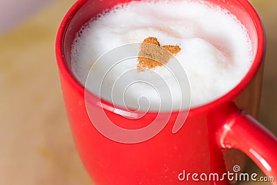 Cinnamon heart on the top of a latte Stock Photo