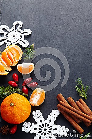 Cinnamon,hips, crochet snowflake,fir on dark vintage background.Christmas holiday. Stock Photo