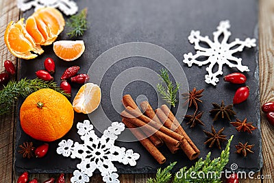 Cinnamon,hips, crochet snowflake,fir on dark vintage background.Christmas holiday. Stock Photo