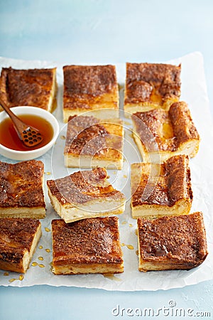 Cinnamon honey cheesecake pie cit into squares Stock Photo