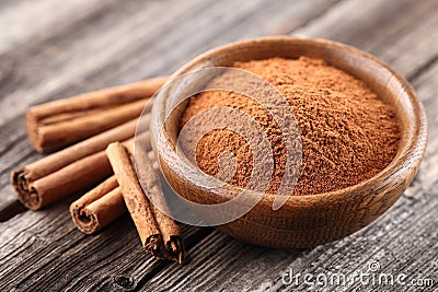 Cinnamon powder with sticks Stock Photo