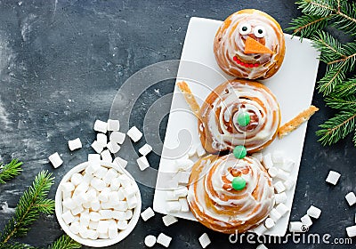 Cinnamon roll snowman - funny idea for kids Stock Photo