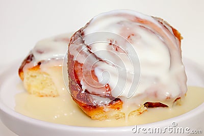 Cinnamon Rolls and Icing Stock Photo