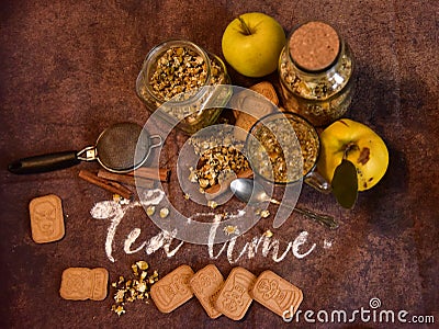 Cinnamon rols, fruits, cookies and cup of tea Stock Photo