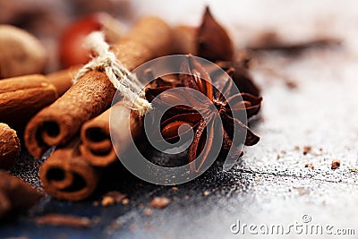 Cinnamon, staranise and cloves. winter spices on rustic table Stock Photo