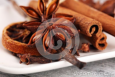 Cinnamon, staranise and cloves. winter spices on wooden table Stock Photo