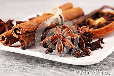 Cinnamon, staranise and cloves. winter spices on wooden table Stock Photo