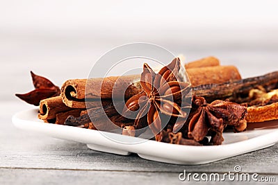 Cinnamon, staranise and cloves. winter spices on wooden table Stock Photo