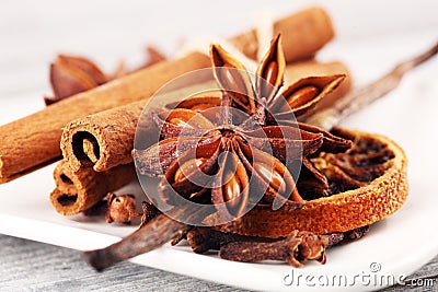 Cinnamon, staranise and cloves. winter spices on wooden table Stock Photo