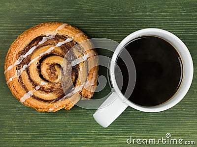 Cinnamon Swirl Danish Pastry With a Mug of Black Coffee Stock Photo