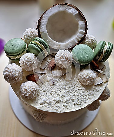 circle, cake with grated coconut and macaroon. dessert for my lady's party. Stock Photo