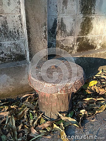 Circle cement chair beside of wall Stock Photo