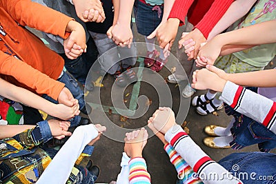 Circle from children, who are held for hands Stock Photo