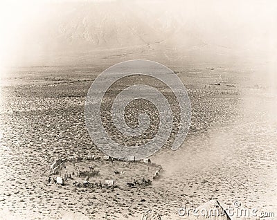 Circle of covered wagons on open plain Stock Photo