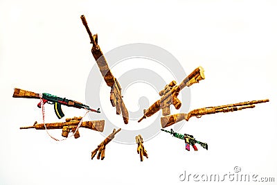 Circle of Fake AK Kalashnikov assault rifles hanging on white background Stock Photo