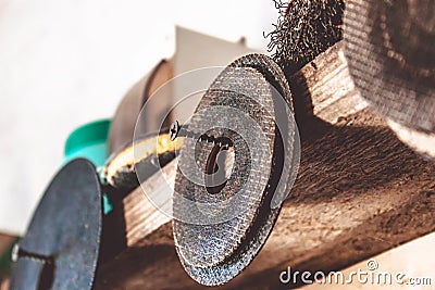 Circles for angle grinders are on wooden shelves. The concept of tools and repair work Stock Photo