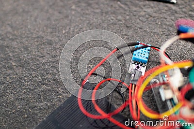 Circuit with wires and connections to a microcontroller built by students for engineering and educational informatics activities. Stock Photo