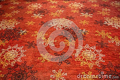 Circular flower shaped designs on a floor mat or carpet Stock Photo