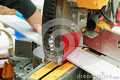 Circular saw blade cutting window fiber glass extruded profile Stock Photo