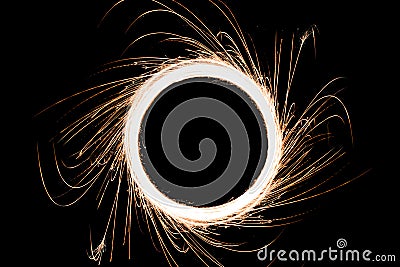 Circular sparkling light and sparks with outside Sparkles trails made by using sparkle stick. Look like conceptual black hole and Stock Photo