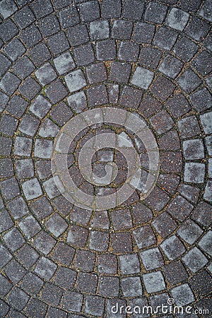 Circular texture of square stone floor. Urban cobble paving laid out of circles Stock Photo