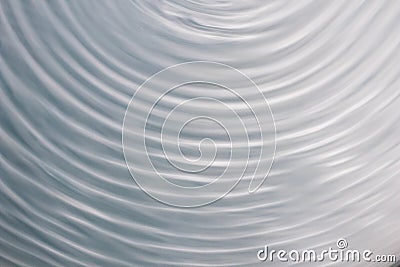 Circular wave motion in a fluid system. blue gray background for Stock Photo