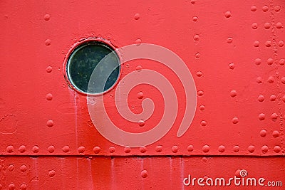 Circular window isolated in a red wall Stock Photo