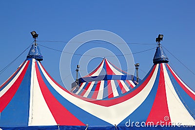 Circus tent under blue sky colorful stripes Stock Photo