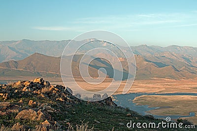 Cirrus clouds hovering above drought stricken Lake Isabella in the southern range of California's Sierra Nevada mountains Stock Photo