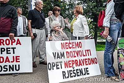 Citizens protesting with posters against the amendment of the electoral law in Sarajevo Editorial Stock Photo